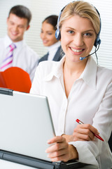 Canvas Print - Pretty consultant sitting at a table 