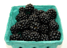 A Pint Of Organic Blackberries Still In Their Container