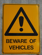 beware of vehicle sign 