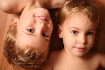 Wall Mural - two children lie on floor