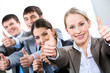 © pressmaster - Portrait of business people giving the thumbs-up sign