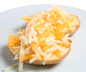 Wall Mural - Baked Potato topped with grated  Cheddar cheese