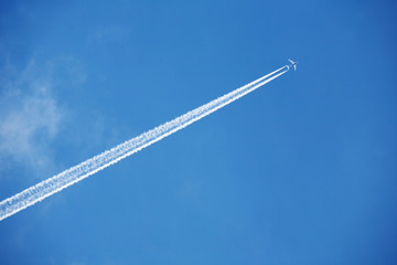 an airplane trail across the sky