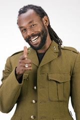 Wall Mural - A Black man in a Army jacket isolated on a white background.