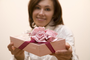 Young woman make a present  