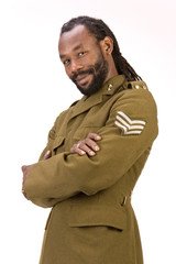 Wall Mural - A Black man in a Army jacket isolated on a white background.