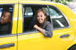 © Stephen Coburn - A pretty business woman getting out of a taxi cab
