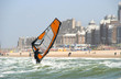 Wind surfer with backdrop of Scheveningen resort in Holland