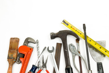 Old used vintage tools over a  white background