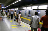 passengers awaiting metro train, delhi, india