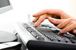 © pressmaster - A business lady’s hands on the keys typing documents