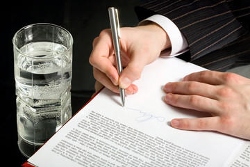 Canvas Print - Conceptual image of a business man signing a document