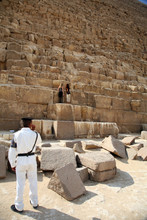 A Policeman Watching Two Women In Kefren Pyramid