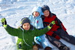 © Marzanna Syncerz - Happy kids sitting in snow