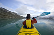yellow kayak in glacier frost lake
