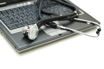 Wall Mural - Stethoscope and laptop illustrating concept of digital security