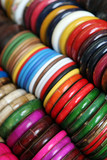 Fototapeta Tęcza - Rows of colorful wooden bracelets - shallow DOF.