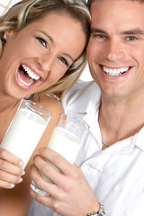 Wall Mural - young love couple drinking milk. over white background .