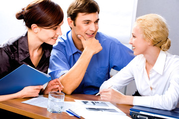 Poster - Three successful business people discussing working idea