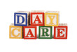 Abc blocks lined up to spell the word daycare - isolated
