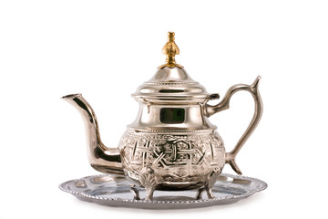 Ancient silver teapot on a white background