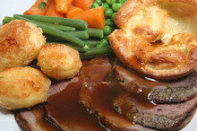Roast Beef Dinner With Yorkshire Pudding And Vegetables