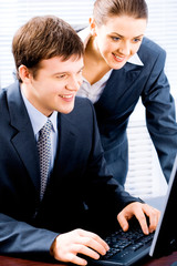 Poster - Portrait of two confident business people working together