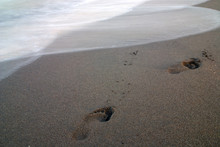 Footprints On Beach