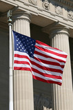 Fototapeta  - USA flag against ionic columns, Washington DC