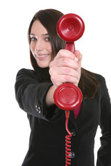 A pretty business woman holding a red phone