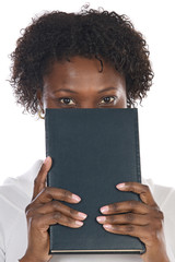 Wall Mural - African american woman with book in her face