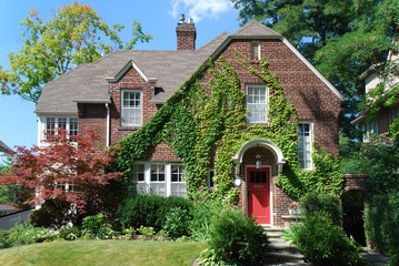 Canvas Print - house with large vine covered gable