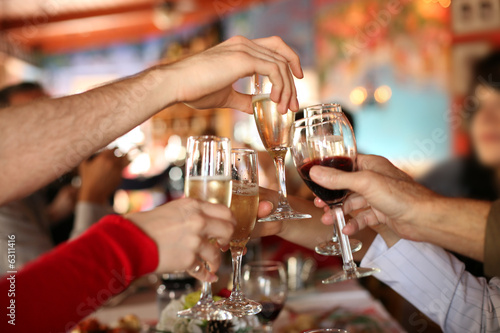 Fotografie, Obraz Celebration. Glasses of champagne and wine in hands.