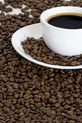 Wall Mural - Cup of coffee and coffee beans background