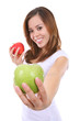 © Stephen Coburn - A pretty woman holding two colorful ripe apples