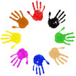 Multi coloured painted handprints arranged in a circle on white
