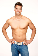 Poster - Smiling young strong  man. Isolated over white background.