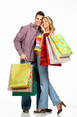 Wall Mural - shopping couple smiling. isolated over white background.