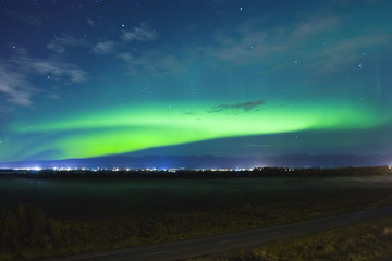 Wall Mural - Northern lights over small town