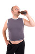© Simone van den Berg - Overweight man with beerbelly having a sip from his beer