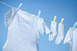 Eco friendly  laundry drying on clothes line against a blue sky 