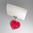 A heart shaped note holder with blank card
