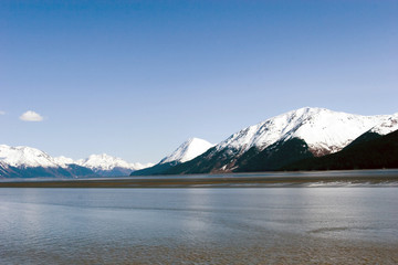 Wall Mural - Snowy mountains by ocean