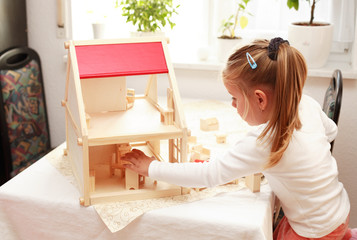 Playing with doll's house