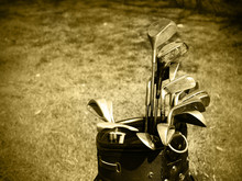 Old Set Of Rough Used Golf Clubs Sepia Image