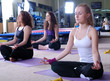 © .shock - Beautiful girls meditating in fitness club