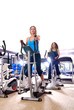 © .shock - Women working out on spinning bikes at the gym