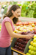 © Monkey Business - Woman choosing apples in produce department