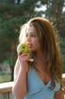 © Guy Shapira - Girl with apple on sunset