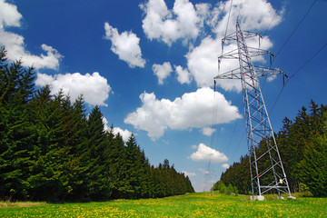 High voltage pylons at spring/summer countryside